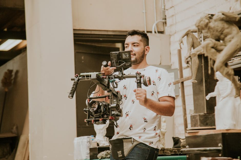 Wedding videographer working diligently behind the camera