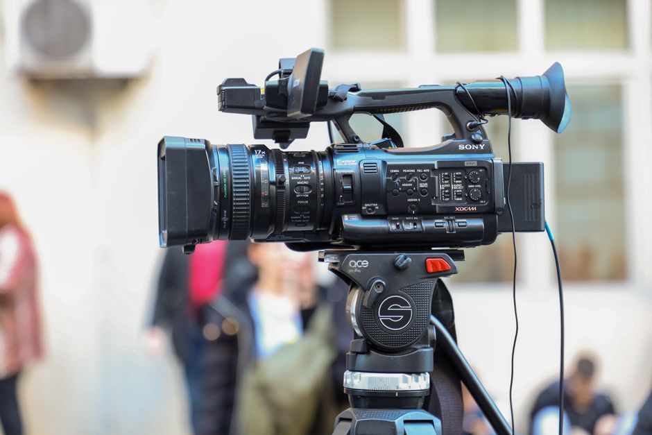 Professional video camera capturing a wedding detail