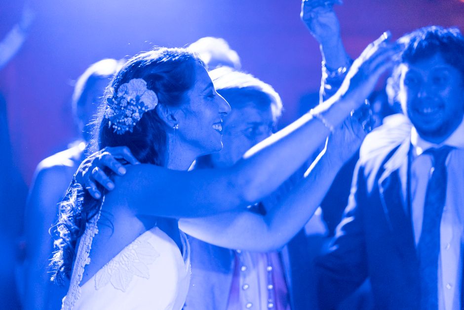 Joyful guests dancing at a wedding reception
